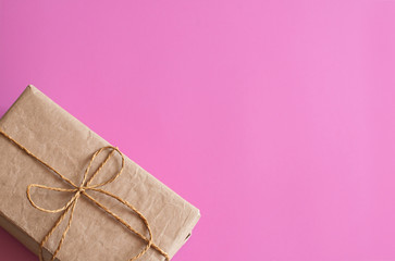 Gift wrapping. Packed gifts, Boxes, paper for gifts, on a pink background. Gifts for Valentine's...
