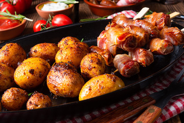 Rustic dates wrapped in bacon and young roasted potato.