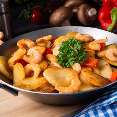 a delicious fried potato and shrimp pan