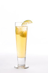 Lemonade with lime slice in tall glass isolated on white background
