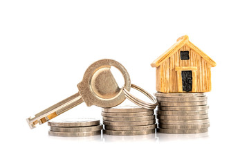 Close up house model place on stacking of money coin for a home mortgage and loan ,  refinance or...