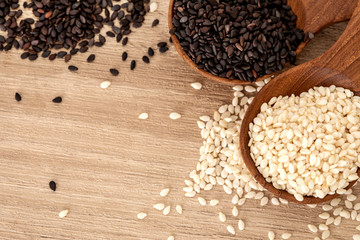 organic Black and White sesame seeds in wooden spoon ,a healthy food for reductions in both systolic and diastolic blood pressure