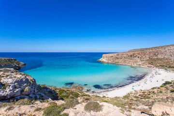 Lampedusa Island Sicily - Rabbit Beach and Rabbit Island  Lampedusa “Spiaggia dei Conigli” with turquoise water and white sand at paradise beach. - obrazy, fototapety, plakaty