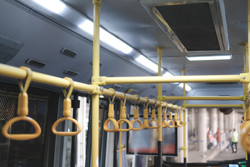 handle on commuter bus. public transport