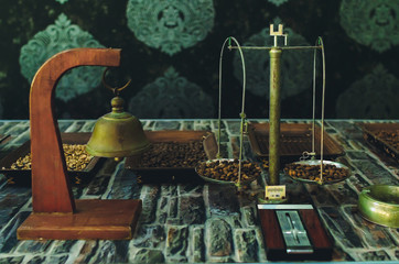 coffee beans on old vintage scales. manual coffee grinder