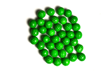 Green chewing gum isolated on white background.