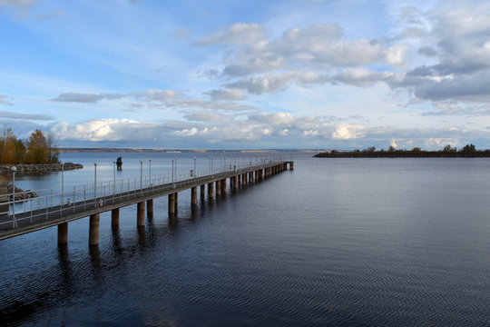 Pier on river Volga in autumn day. Beautiful calm secene in the evening.