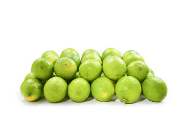 Many fresh limes on white background.