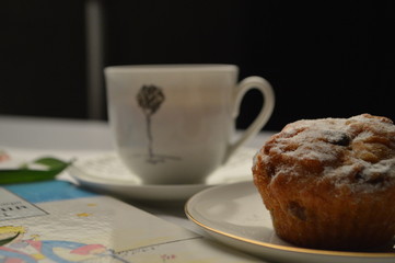 cup of coffee and cookies on a table