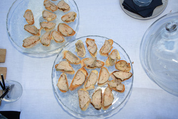 food toast of duck foie gras arranged in plates for an event