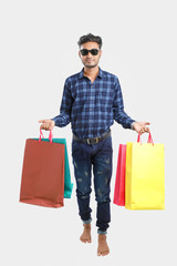 young indian man with shopping bags, Indian festival