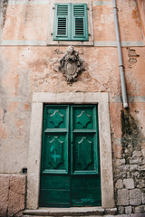 stucco ornament with knight armor above the door