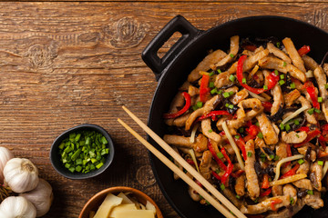 Pork chop with peppers, mushrooms and bamboo. Served with rice.