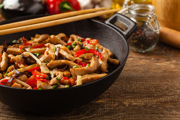 Pork chop with peppers, mushrooms and bamboo. Served with rice.