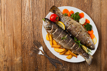 Grilled whole trout. Served with baked potatoes.