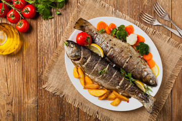 Grilled whole trout. Served with baked potatoes.