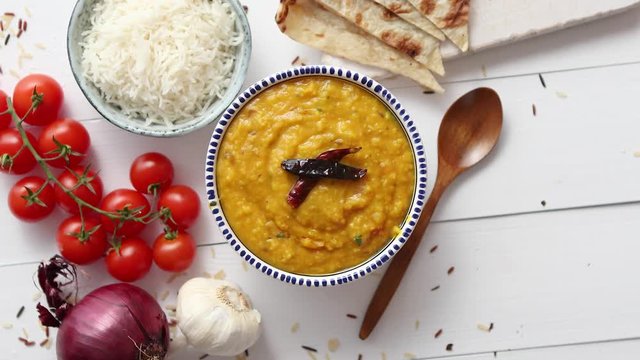 Indian popular food Dal fry or traditional Dal Tadka Curry served in bowl