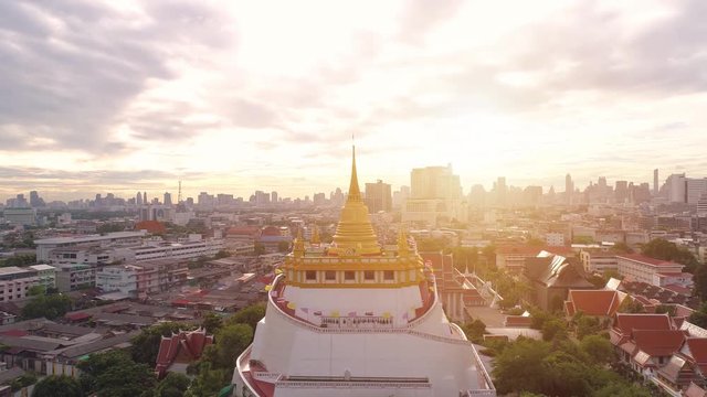 Aerial view of Wat Saket in Bangkok - Temple of the Golden Mountain, Wat Saket, popularly known as the Golden Mount or 'Phu Khao Thong , is a low hill crowned with a gleaming gold chedi. 