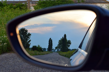 Fototapeta na wymiar Country road in mirror image