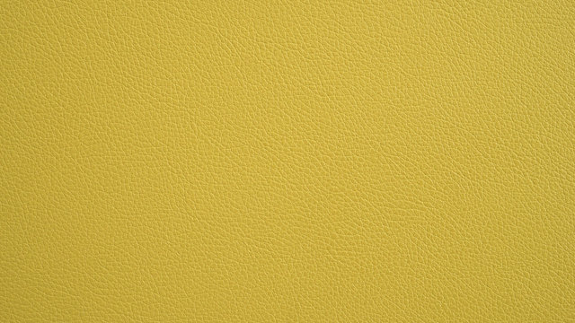 Texture of grunge panorama yellow leather. Yellow background.