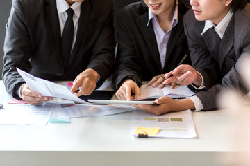 Group new generation of businessman who have succeeded in their work showing financial report in the meeting.