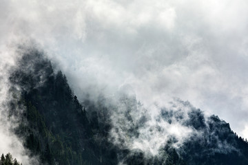 Naklejka na ściany i meble clouds over a mountain #7