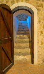 Stairs, Interior of a medieval castle in Toledo, Spain. Stone rooms with wooden furniture, medieval period of the Spanish reign