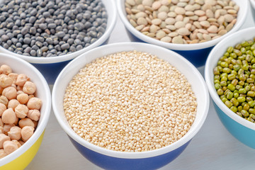 Various legumes in small bowls