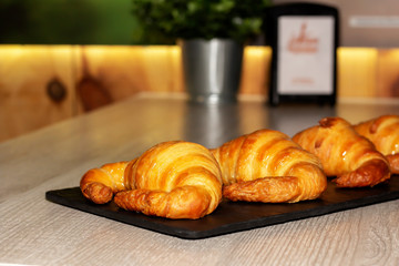 having breakfast with croissant