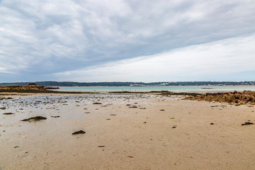 Looking out over St Aubins Bay on the island of Jersey, from the beach near Elizabeth Castle, at low tide