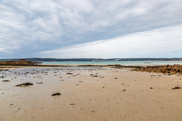 Looking out over St Aubins Bay on the island of Jersey, from the beach near Elizabeth Castle, at low tide