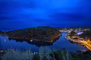 PAXOS ISLAND, CORFU PREFECTURE, IONIAN SEA, GREECE. Gaios, the "capital" of Paxos island, the islet of Aghios Nikolaos (left) and the beautiful canal between them.
