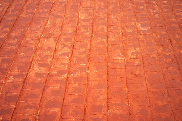 Red pavement bricks textured background.