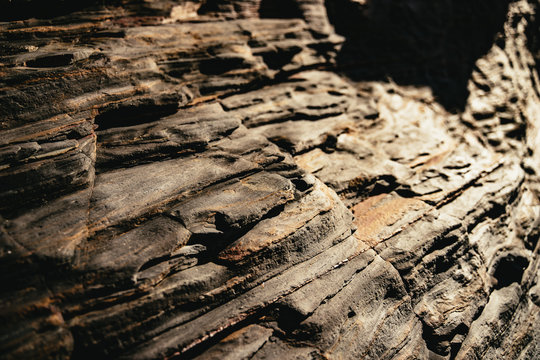 Eroded exposed layered rock strata on a beach
