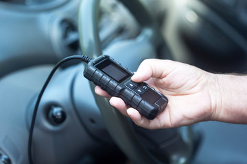 Man using car diagnostic scan tool