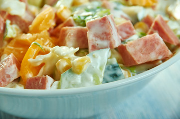 Cabbage salad with ham, cucumber and corn