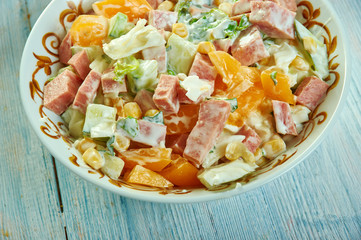 Cabbage salad with ham, cucumber and corn