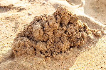 Heap of sand on sea beach.