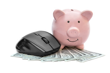 Computer mouse with piggy bank and money on white.