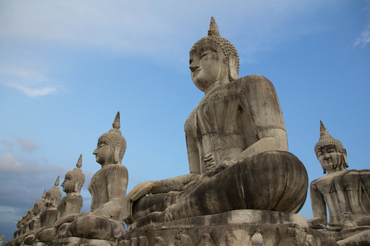 Buddha face in blue sky background, Buddha statue in Thailand.