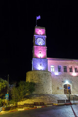 Night view of the clock tower of Wolfson Community Center building in a square in the old city of Safed in northern Israel