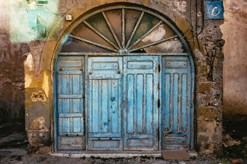 Old arched wooden door in Essaouira, Morocco