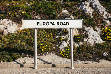 Front view of EUROPA ROAD sign beside road