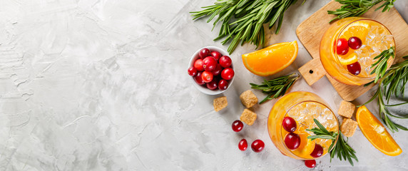 Cold season drink - cranberry and rosemary cocktail, copy space