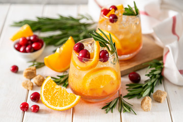 Cold season drink - cranberry and rosemary cocktail, copy space