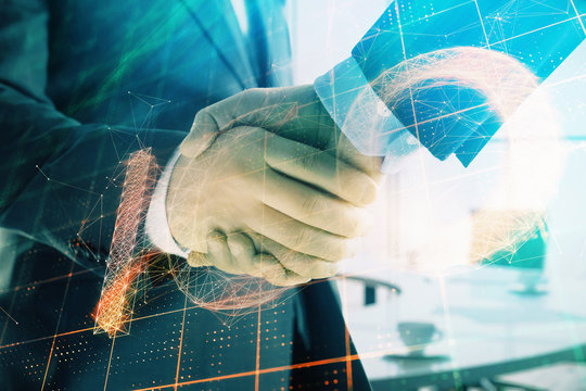 Double exposure of blockchain theme drawing on office background with two businessmen handshake. Concept of crypto economy