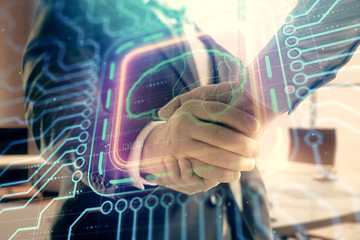 Double exposure of brain drawing on office background with two men handshake. Concept of innovation