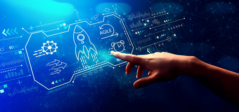 Agile concept with hand pressing a button on a technology screen