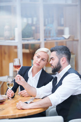 Professional cavists with wine samples examining their color