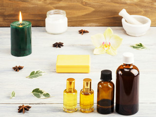 Still life from natural aromatherapy and spa ingredients on a white wooden background